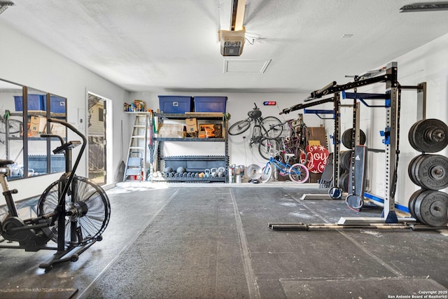 interior space with a garage and a textured ceiling