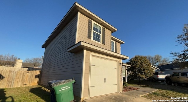 view of property exterior featuring fence