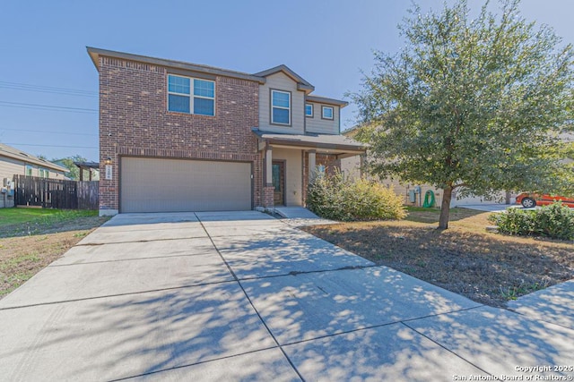 view of front of home with brick siding, driveway, an attached garage, and fence