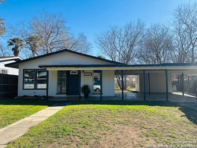 view of front of house with a front yard and a porch