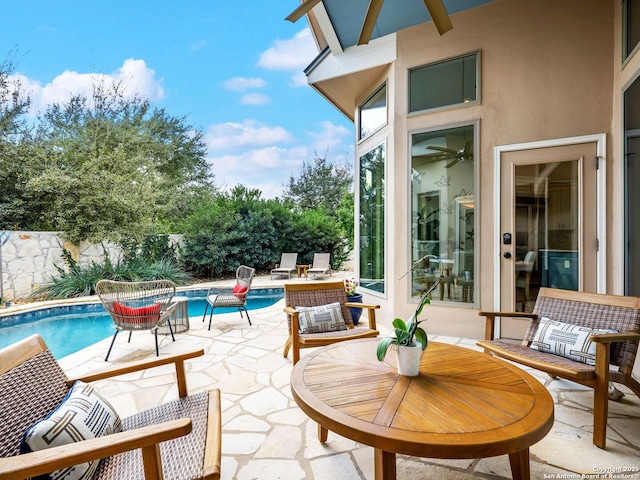 view of patio / terrace with a fenced in pool, outdoor lounge area, and fence