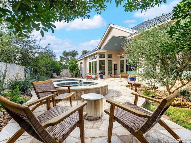 view of patio / terrace featuring a ceiling fan, a swimming pool, and fence