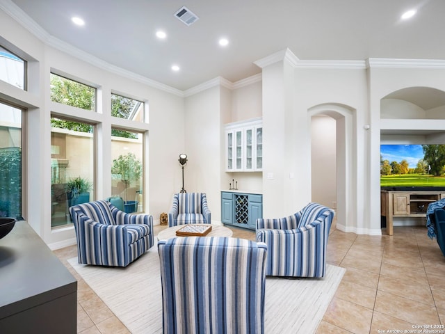 living room featuring a dry bar, light tile patterned floors, recessed lighting, and ornamental molding