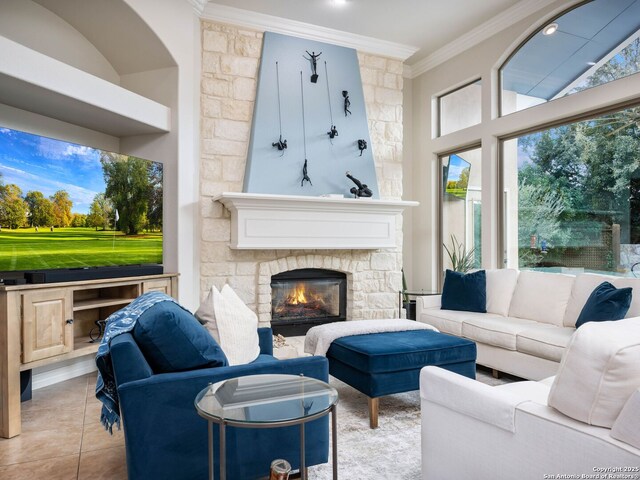 tiled living area with a fireplace and ornamental molding