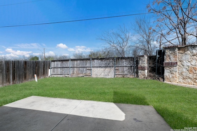 view of yard featuring a patio and a fenced backyard