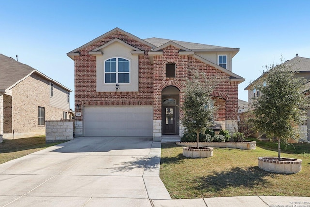 traditional-style home featuring brick siding, an attached garage, concrete driveway, and a front yard