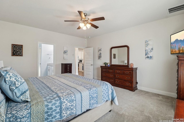 carpeted bedroom with visible vents, ceiling fan, and baseboards