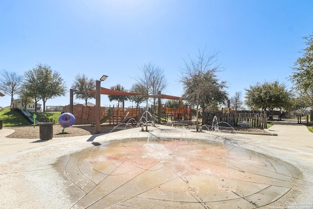 exterior space featuring playground community and fence