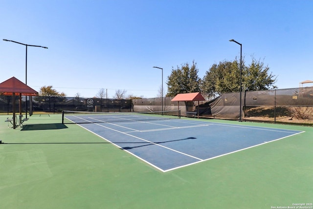 view of sport court with fence