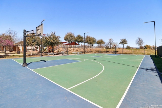 view of sport court featuring community basketball court and fence