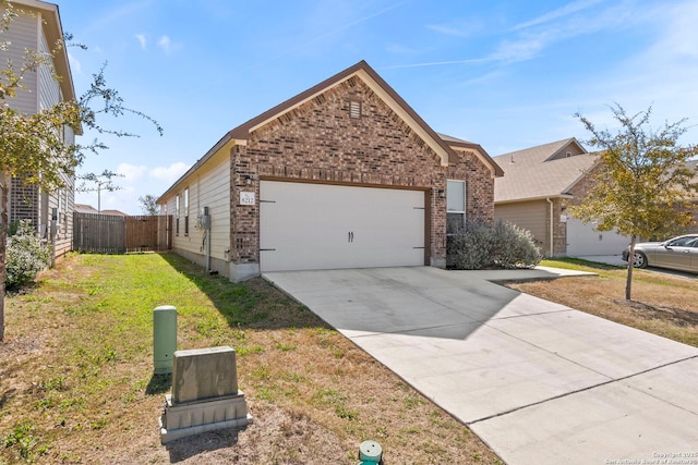 single story home with brick siding, fence, concrete driveway, a front yard, and a garage