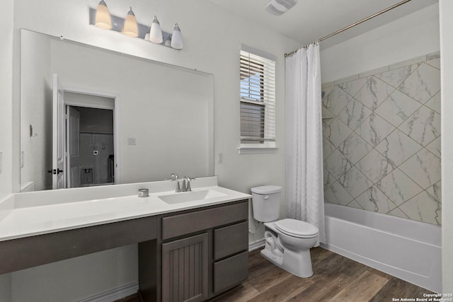 bathroom with visible vents, toilet, shower / tub combo with curtain, wood finished floors, and vanity