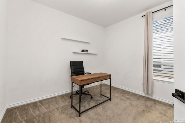 office space featuring baseboards and carpet flooring