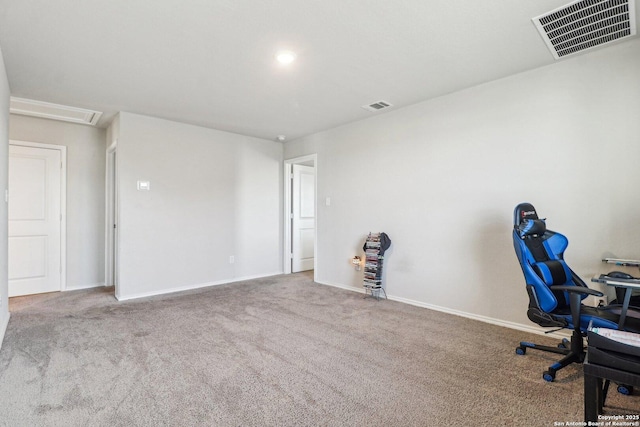 unfurnished office featuring baseboards, visible vents, and carpet floors