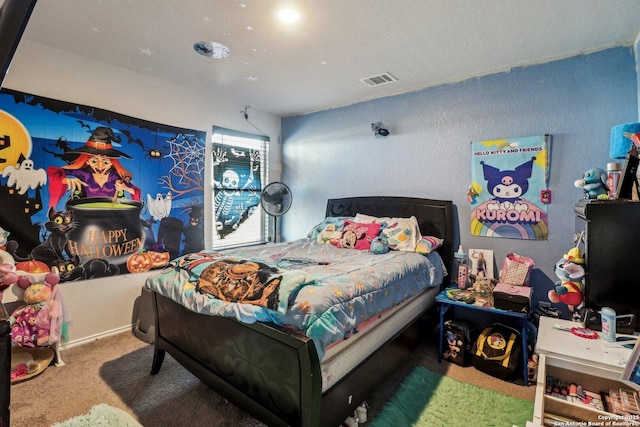 carpeted bedroom featuring visible vents