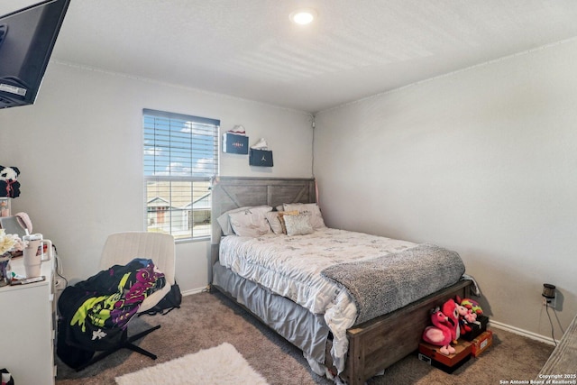 carpeted bedroom with baseboards