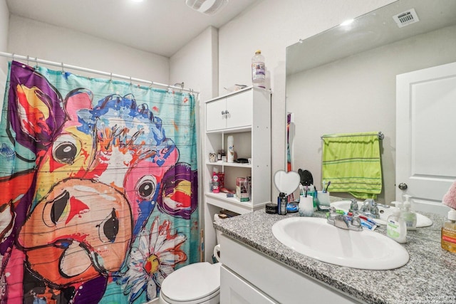 bathroom with vanity, toilet, a shower with curtain, and visible vents