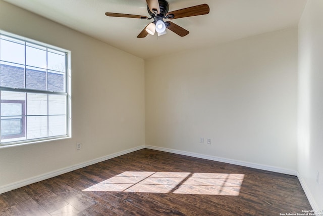 spare room with a ceiling fan, baseboards, and wood finished floors