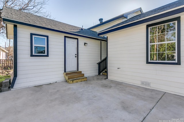 rear view of house featuring a patio area and entry steps