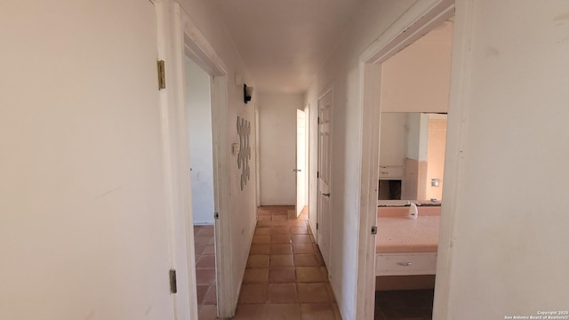 corridor with tile patterned flooring