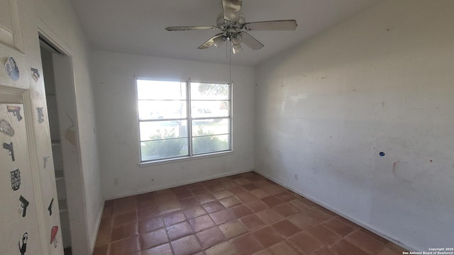 spare room with a ceiling fan