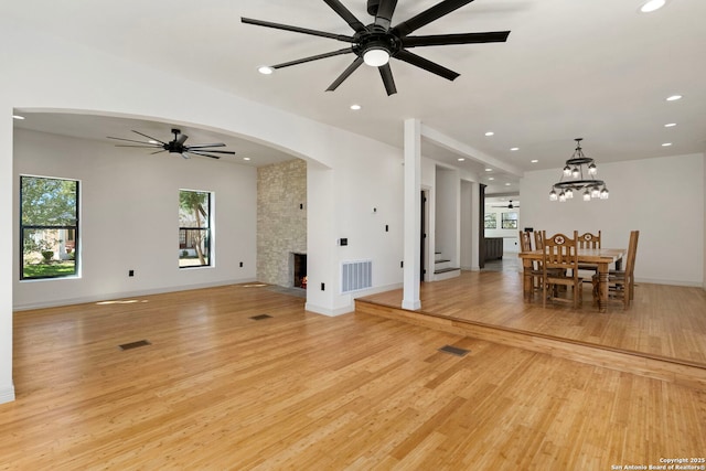 unfurnished living room featuring recessed lighting, light wood-style floors, visible vents, and a large fireplace