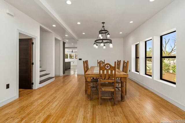 dining space featuring recessed lighting, light wood-type flooring, and a wealth of natural light