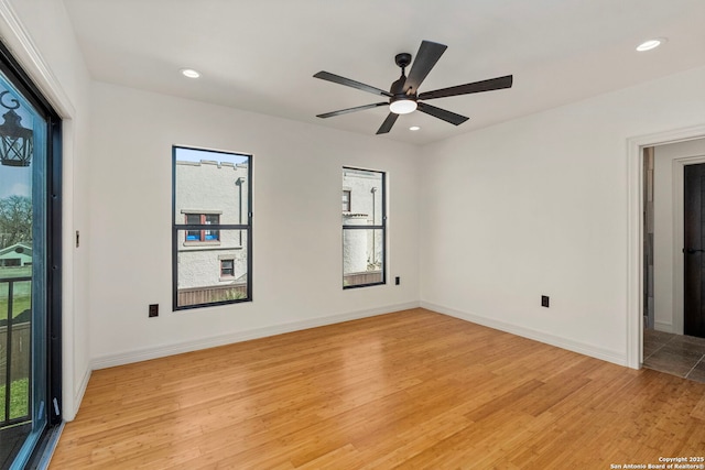 spare room with recessed lighting, baseboards, light wood-style floors, and ceiling fan