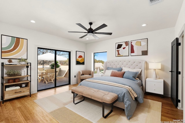 bedroom with access to outside, recessed lighting, wood finished floors, and ceiling fan