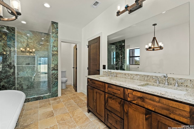 bathroom featuring a sink, visible vents, toilet, and a stall shower