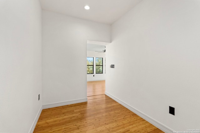 unfurnished room featuring recessed lighting, baseboards, and light wood finished floors