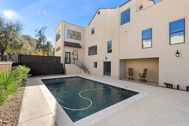 view of pool with a patio, fence, and a fenced in pool