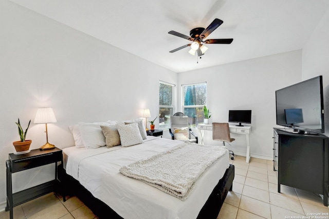 bedroom with light tile patterned floors, baseboards, and ceiling fan