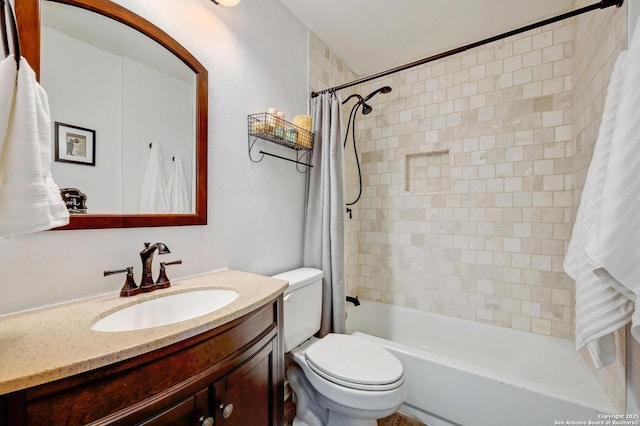 full bathroom with toilet, vanity, and shower / tub combo