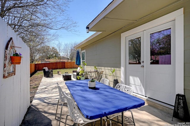 view of patio / terrace featuring outdoor dining area and fence