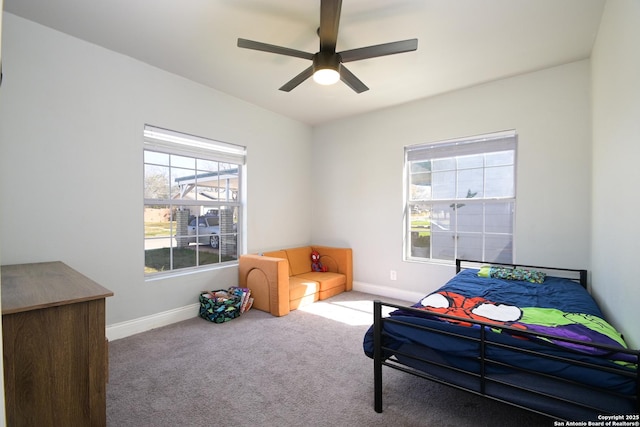 bedroom featuring a ceiling fan, baseboards, and carpet floors