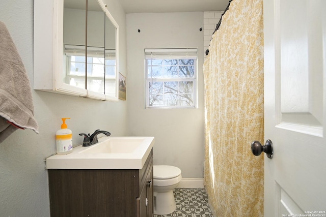 full bath with vanity, toilet, baseboards, and tile patterned flooring