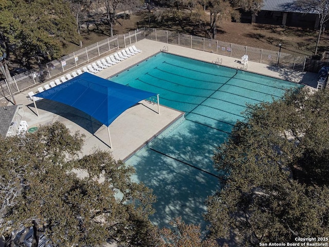 pool featuring a patio and fence