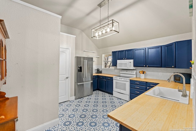 kitchen with white appliances, lofted ceiling, a sink, decorative light fixtures, and blue cabinets