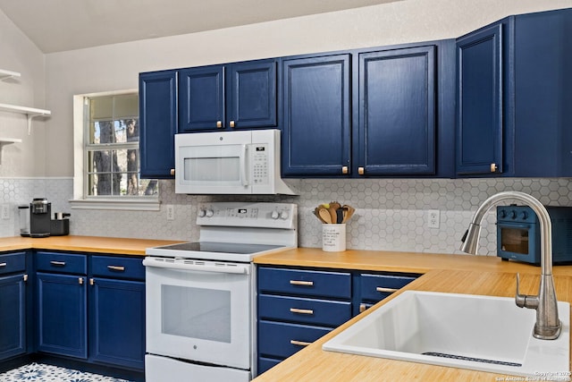 kitchen featuring white appliances, blue cabinets, tasteful backsplash, and a sink