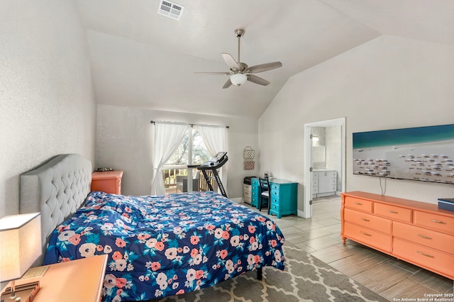 bedroom with a ceiling fan, visible vents, wood finish floors, lofted ceiling, and ensuite bathroom