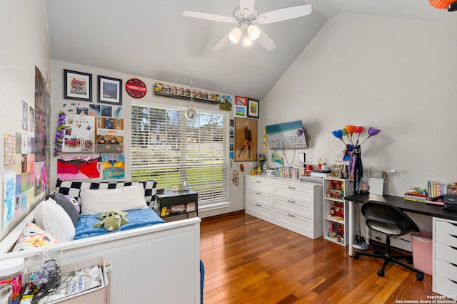 bedroom with ceiling fan, hardwood / wood-style flooring, and vaulted ceiling