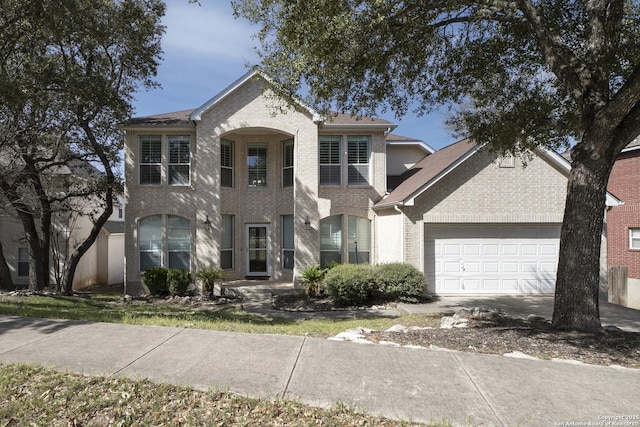 6519 Grove Crk, San Antonio, TX 78256 - view of front of home featuring a garage and brick siding
