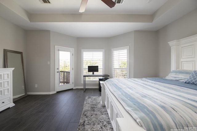 bedroom featuring a ceiling fan, visible vents, baseboards, dark wood finished floors, and access to exterior