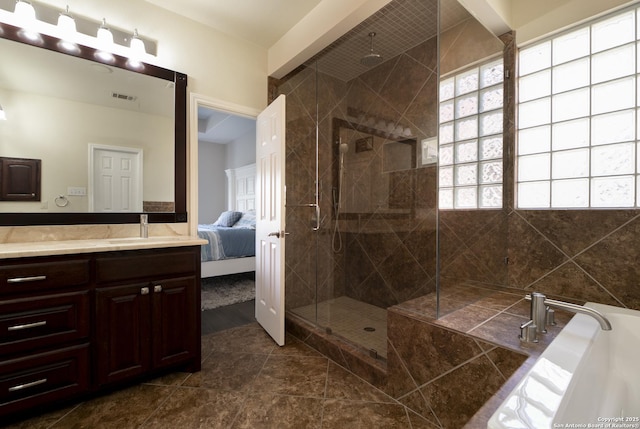 full bath featuring visible vents, connected bathroom, a tile shower, a bath, and vanity