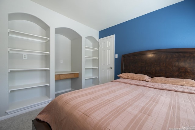 carpeted bedroom with baseboards