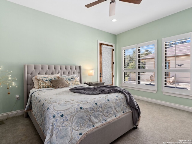 bedroom with carpet flooring, a ceiling fan, and baseboards