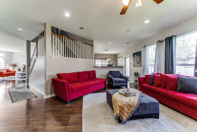 living area featuring recessed lighting, stairway, baseboards, and wood finished floors