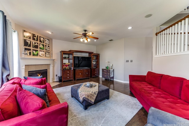 living area featuring visible vents, wood finished floors, recessed lighting, a fireplace, and baseboards