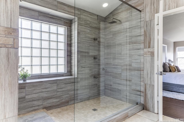 bathroom with a stall shower and ensuite bathroom